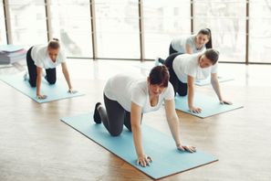 group of four women on Pilates mats